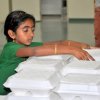 Children assisting in packing the Prasad